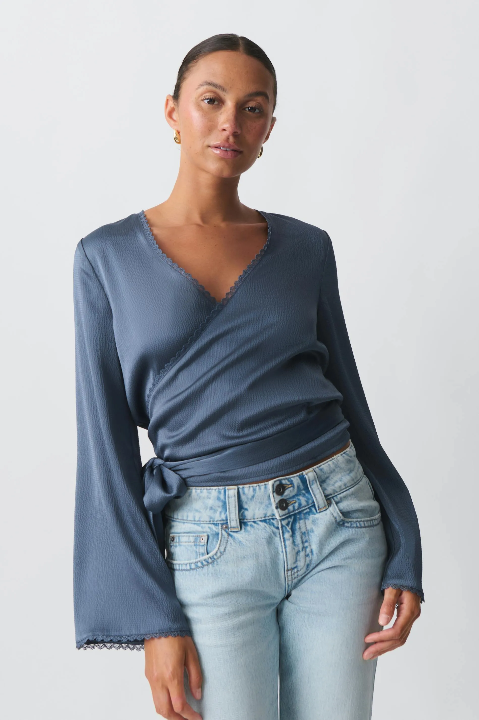 Scalloped edge wrap blouse